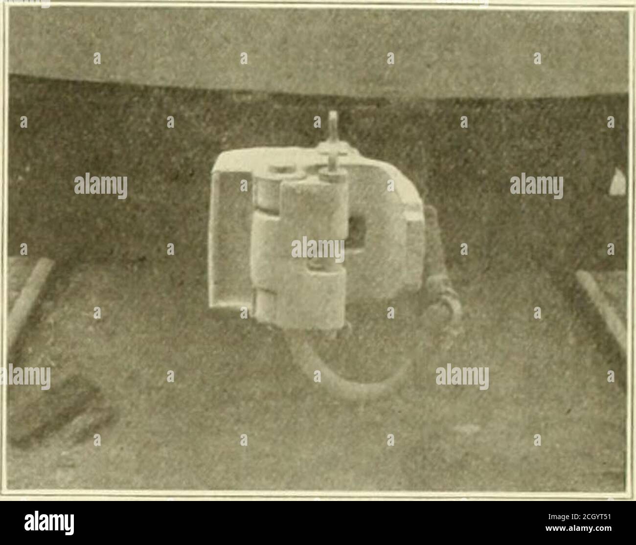 . Electric railway review . Gibbs M. C. B. Type Coupler—Views Showing Cars Coupled on Sharp Curve—Enlarged Front View Showing Pocket. the addition of a pocket on the side, into which a guard armof the opposing coupler mates. The guard arm is of suchlength that it extends to the bottom of the pocket in theopposing coupler. This feature is said to make the couplerabsolutely rigid sidewise and to prevent it from buckling when standing on a 50-foot radius curve, in such a position that thisfeature is demonstrated. The coupler head is made on exactly the same lines as theM. C. B., and in the same s Stock Photo