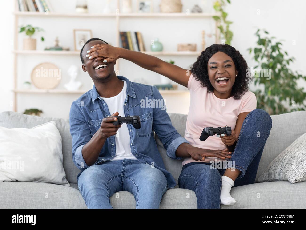 Premium Photo  Cheerful boyfriend and girlfriend playing video