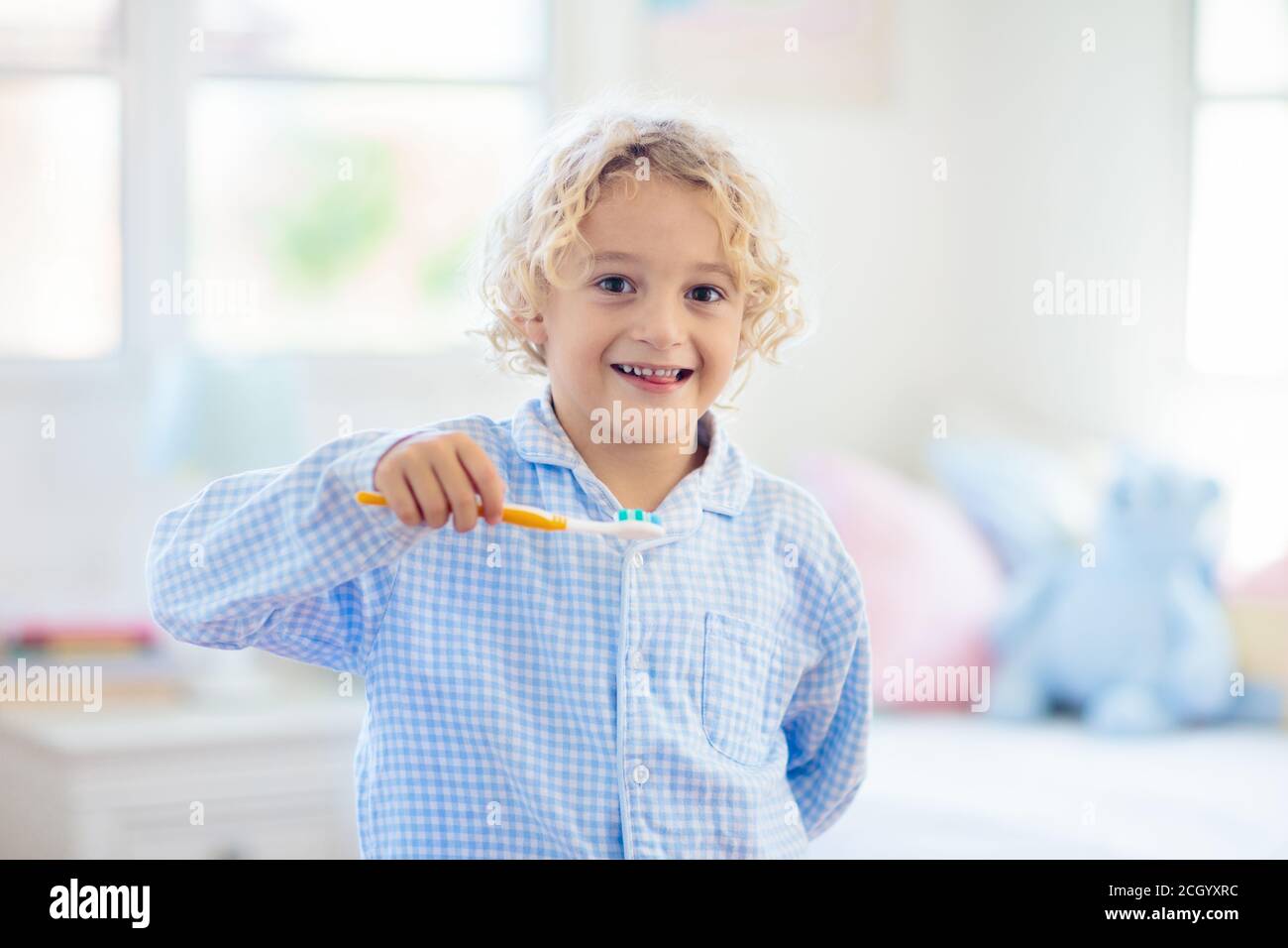 Child brushing teeth. Kids with toothpaste and brush. Dental and oral