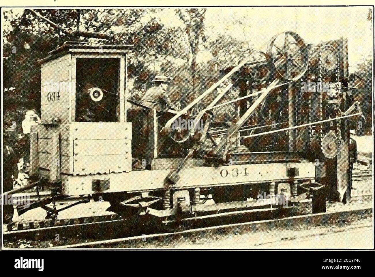 . Electric railway journal . y the whole lengthof the underframe, which consists of four heavy steelchannels extending the entire length of the platform,and tied together by heavy steel end-frame castings.Each channel is riveted to the webs of the end framecastings and to the bolster plates on the bottom. Thebolsters are built up of 1-in. steel plates, 10 in. in widthriveted to all four longitudinal sills. Concrete Breaker in Cleveland THE accompanying illustrations show a new machinedeveloped by Charles H. Clark, engineer mainte-nance of way, Cleveland Railway, to break up the con-crete pavem Stock Photo