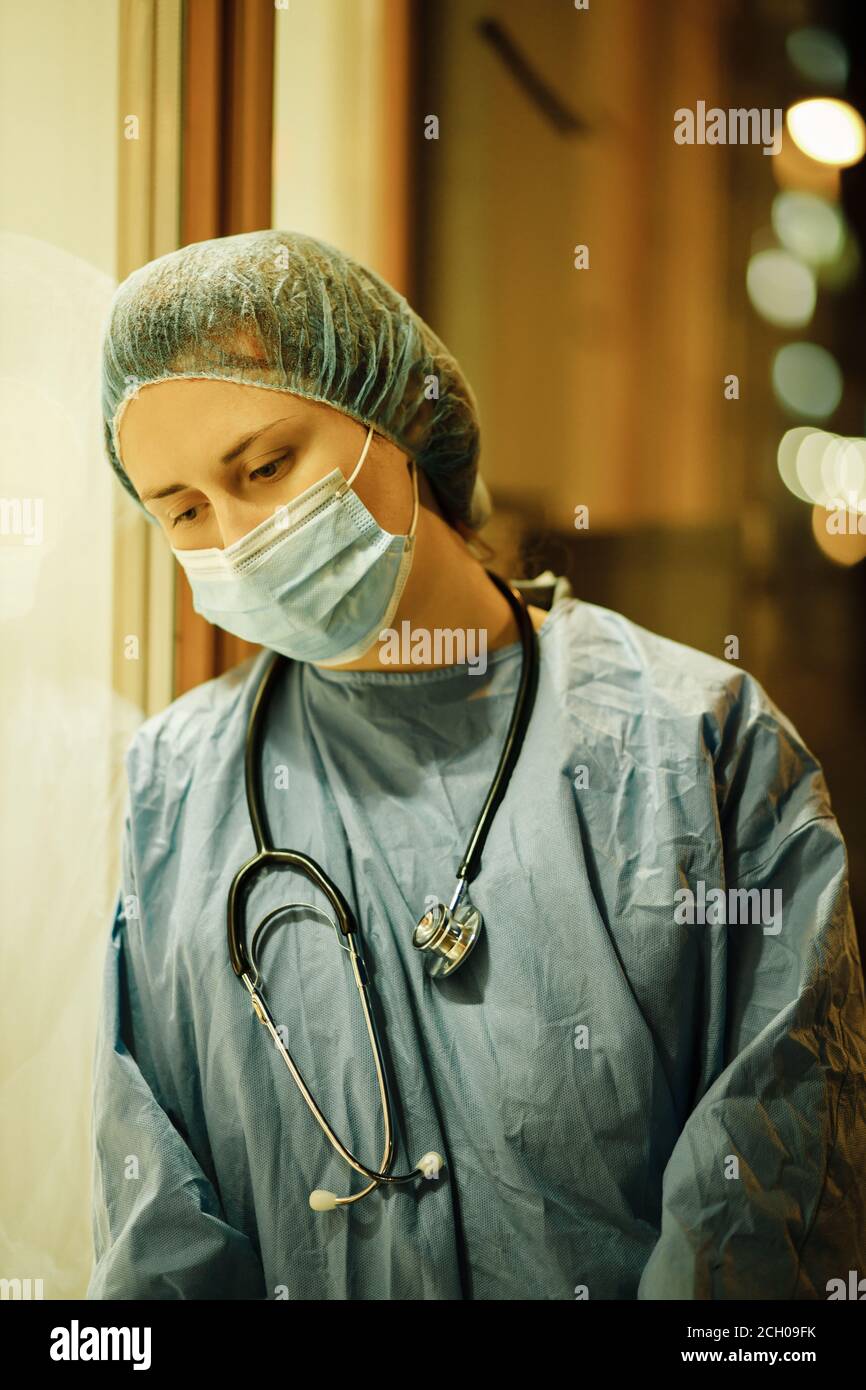 Exhausted medical student or nurse feeling sad during night shift near  hospital Stock Photo - Alamy