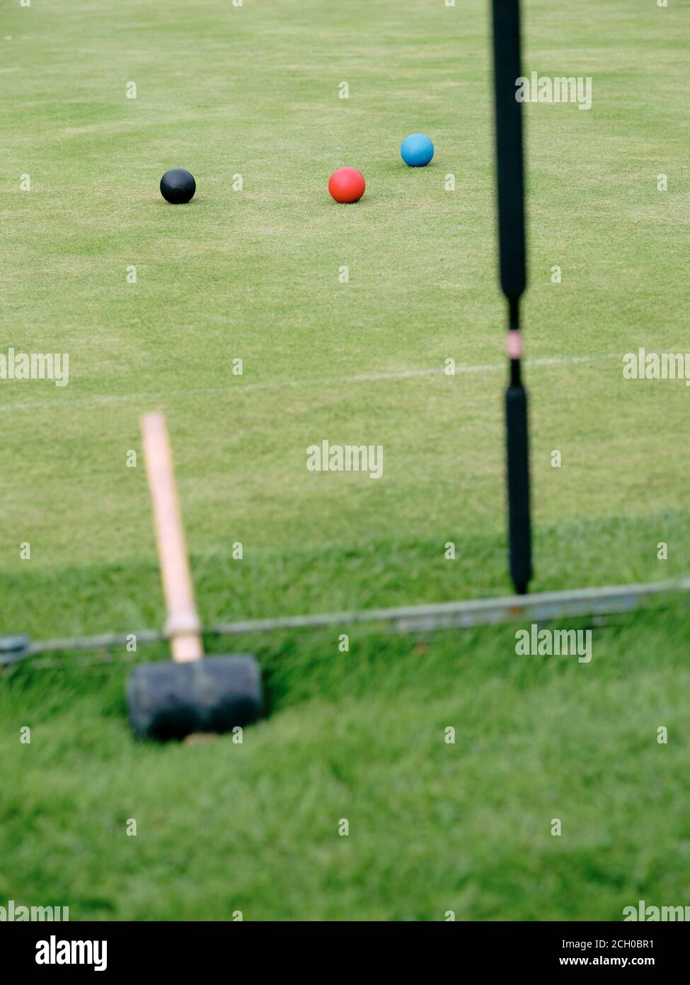 A Croquet lawn with balls and mallets prior to setting up a game