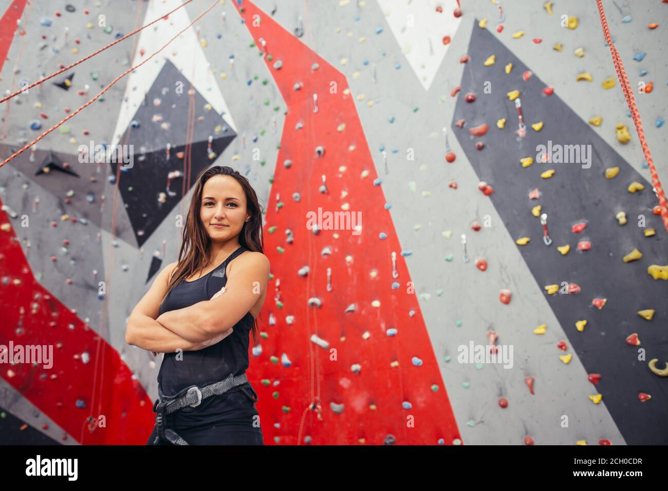 Woman climbing over wall hi-res stock photography and images - Alamy