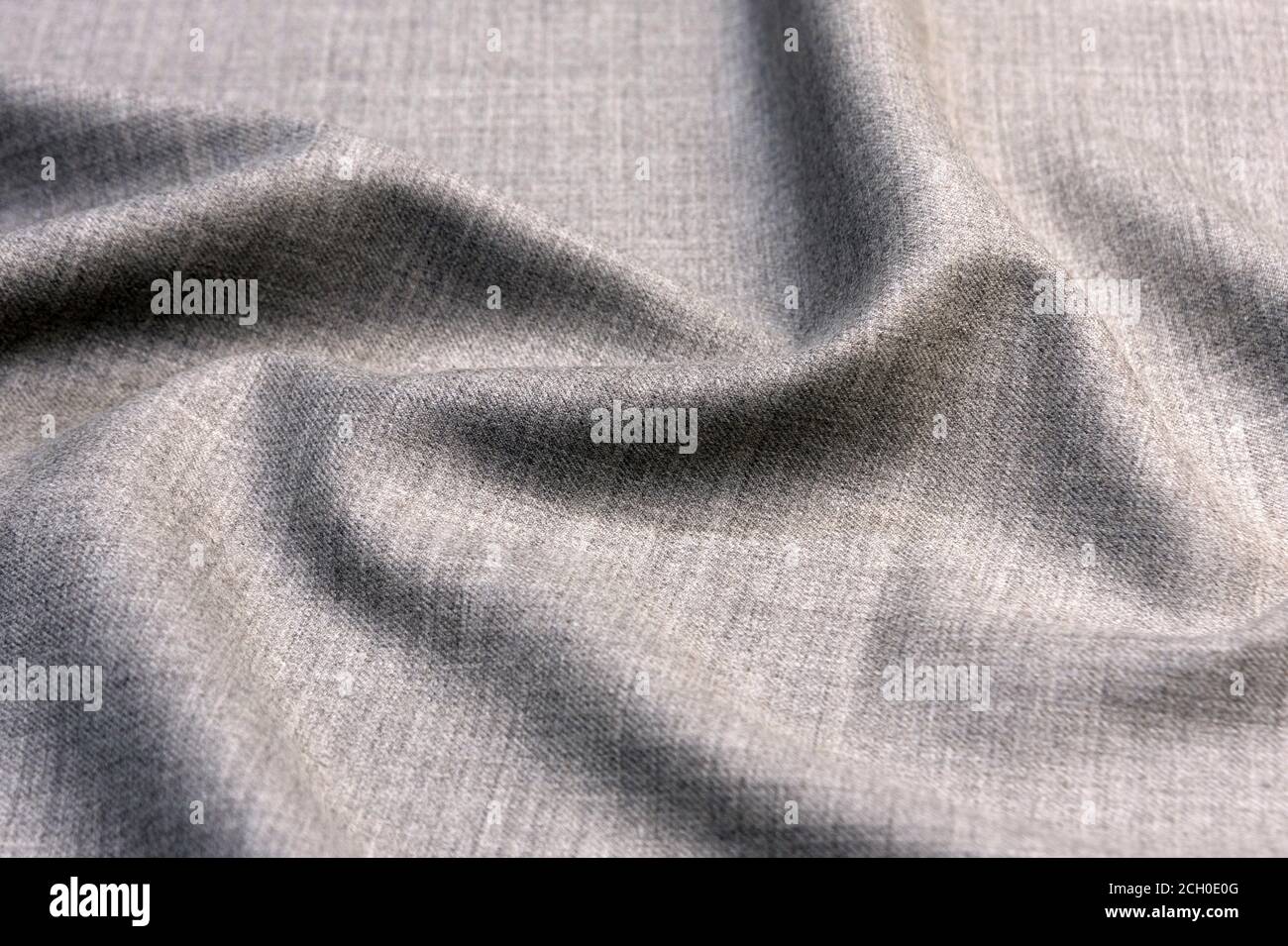 Light natural linen texture background. Wrinkled grey fabric background