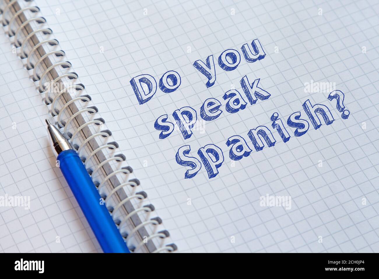 Do you speak Spanish? Text handwritten on sheet of notebook Stock Photo