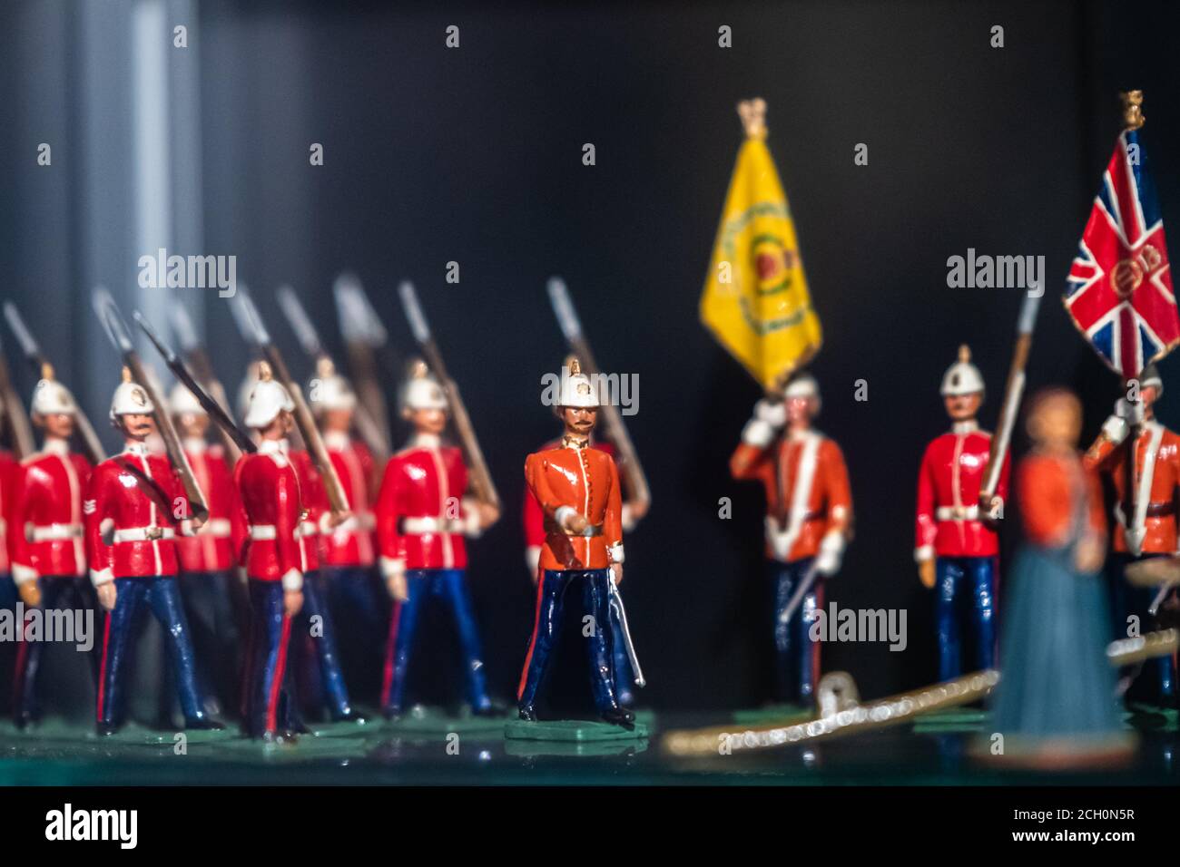 Toy figures of British army soldiers marching in formation on display in museum Stock Photo