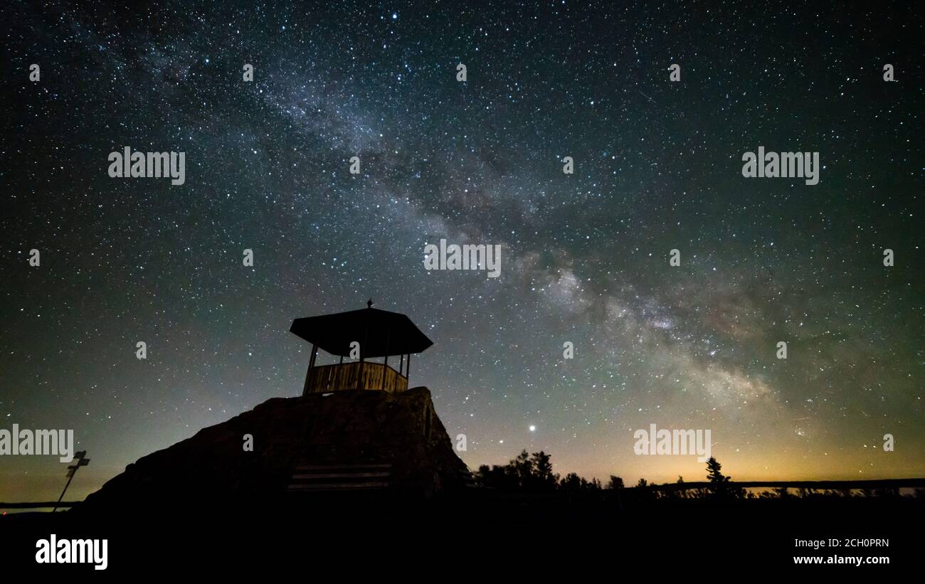 Germany, Black Forest Schwarzwald nature landscape and lodge under millions of stars of the milky ways galaxy by night Stock Photo