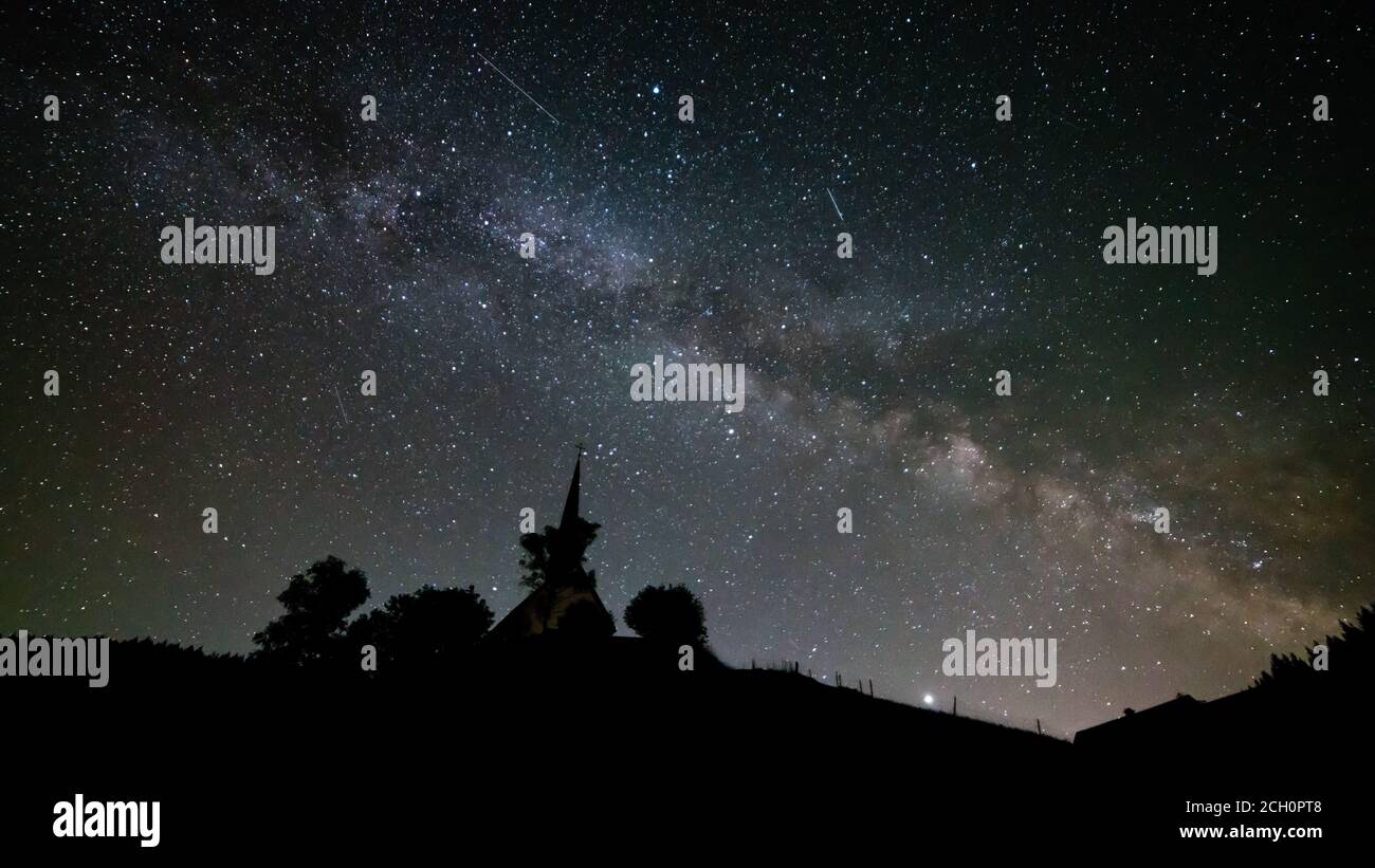 Germany, Black Forest Schwarzwald church or chapel building under millions of stars of the milky ways galaxy by night Stock Photo
