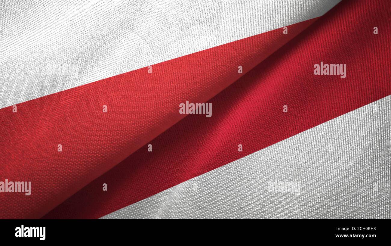 Poland and Indonesia two flags textile cloth, fabric texture Stock Photo