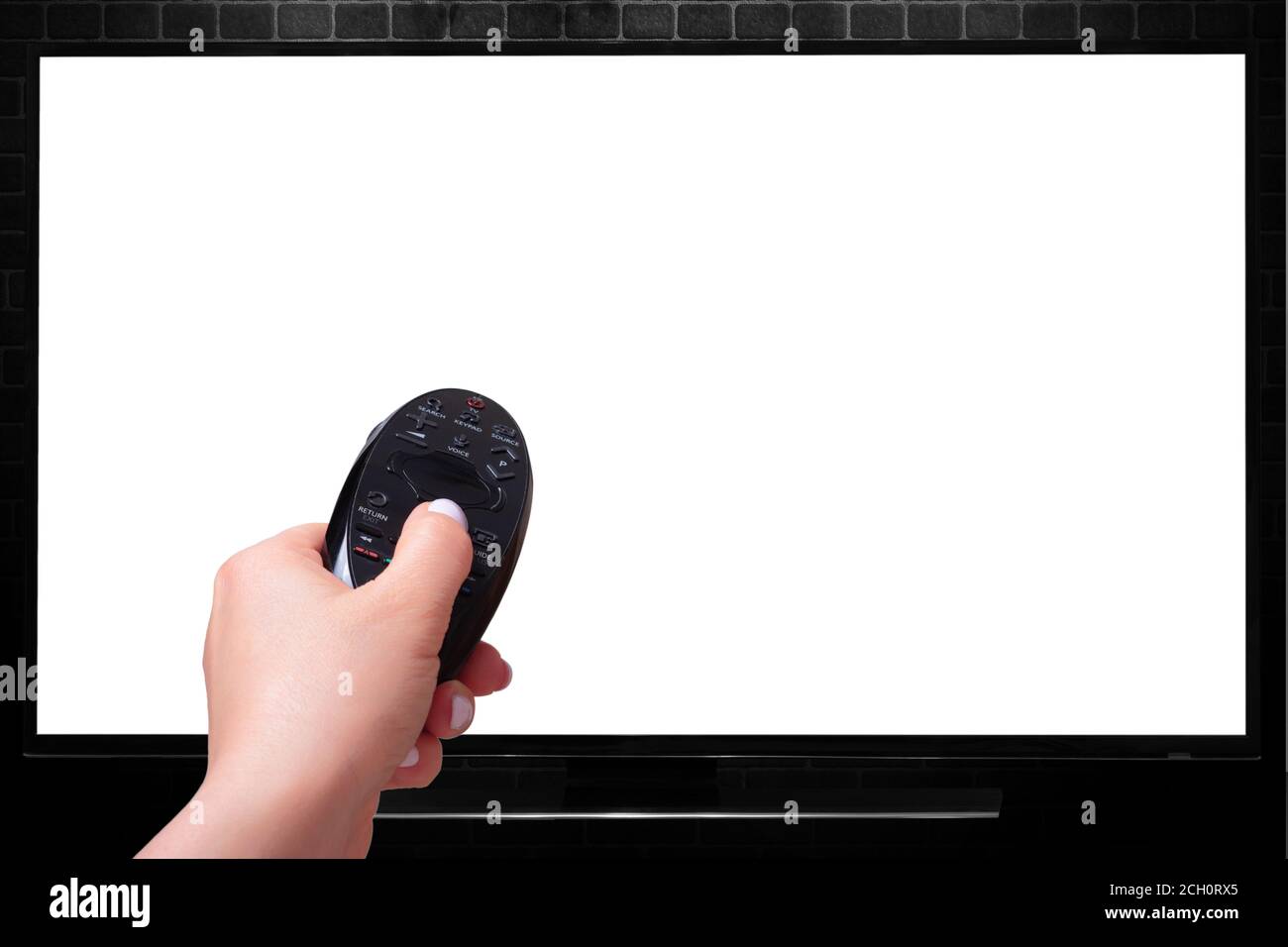 hand with a Remote Control on the background of the TV. isolated on white background. Multimedia streaming concept Stock Photo