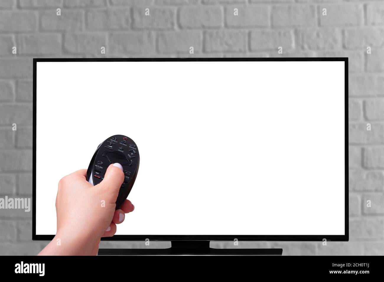 hand with a Remote Control TV. isolated on white background. Multimedia streaming concept Stock Photo