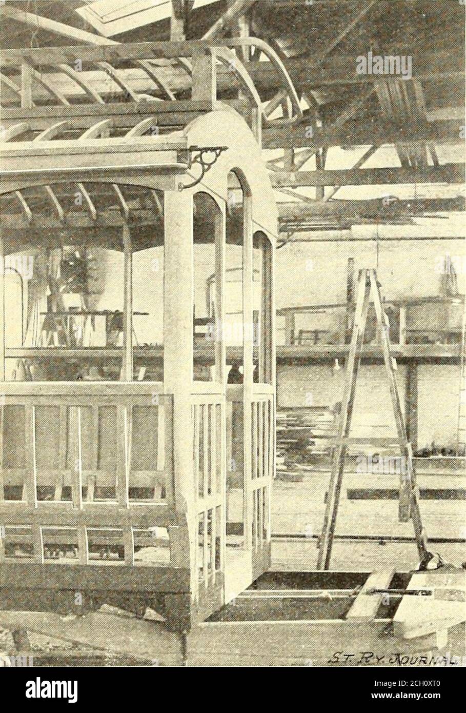 . The Street railway journal . car. Across the sixty-fool street is a large paint shop 70ft. x140 ft., having four tracks for five twenty-foot car bodies. Aninterior view of this shop is shown in Fig. I. Three only of thefour tracks are shown in the engraving. At the time the photo-graph was made, but three cars were in place on each track, butthe shop has accommodations for twenty cars. Adjoining thisshop at the right and connected to it by several doors is an uphol- 126 STREET RAILWAY JOURNAL. [Vol. XII. No. 2. stery and finishing shop 40 ft. x 100 ft. There are also several com-municating s Stock Photo