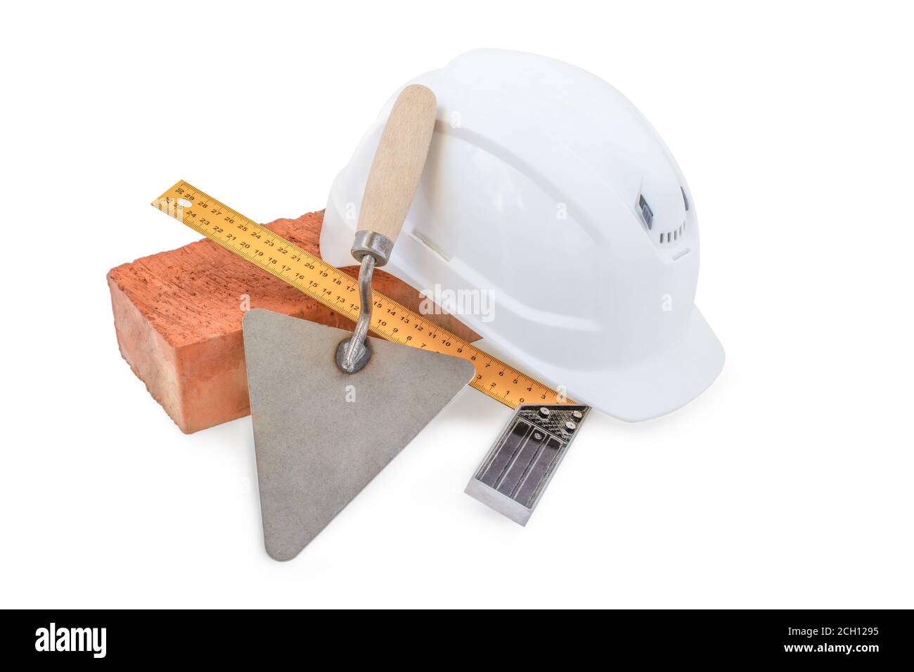 Mason tools. Brick, white helmet, trowel and construction square