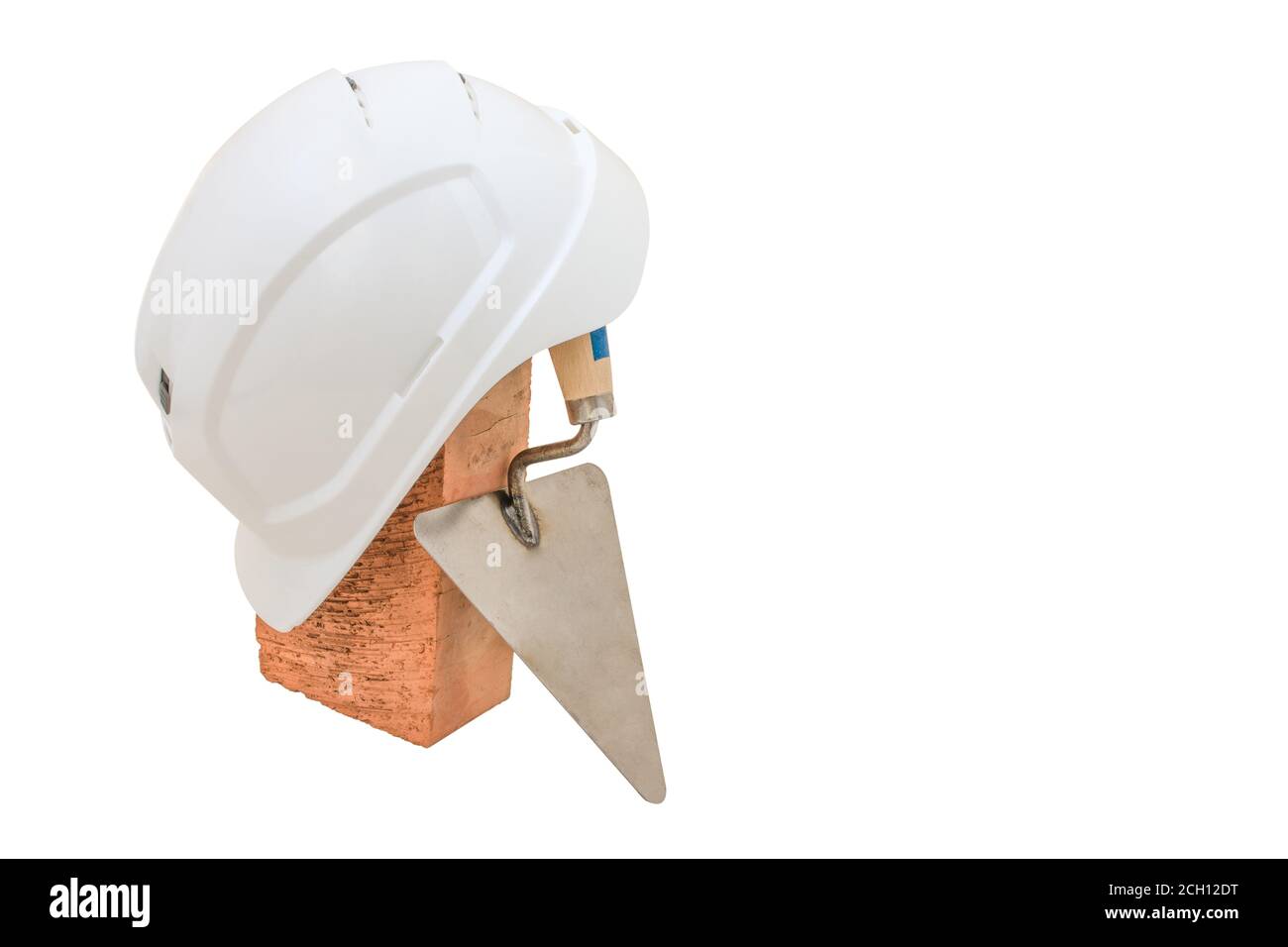 Bricklayer tools. Mason tools - Trowel, bricks and white helmet isolated on white background Stock Photo