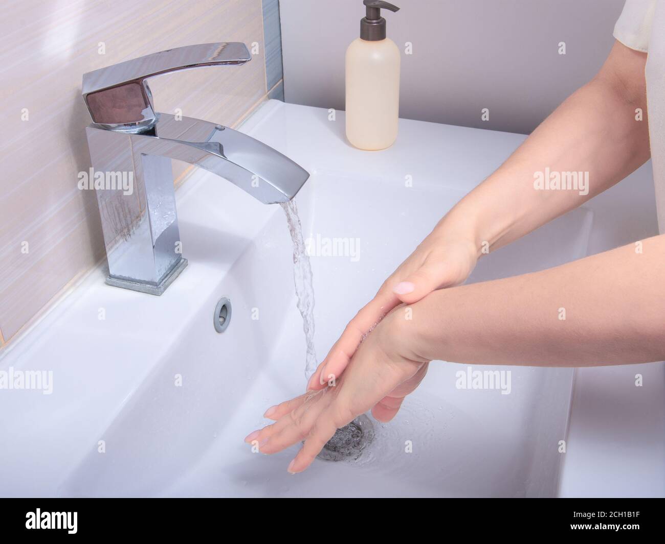 Coronavirus pandemic prevention wash hands with soap warm water , rubbing nails and fingers washing frequently or using hand sanitizer gel. Hygiene co Stock Photo