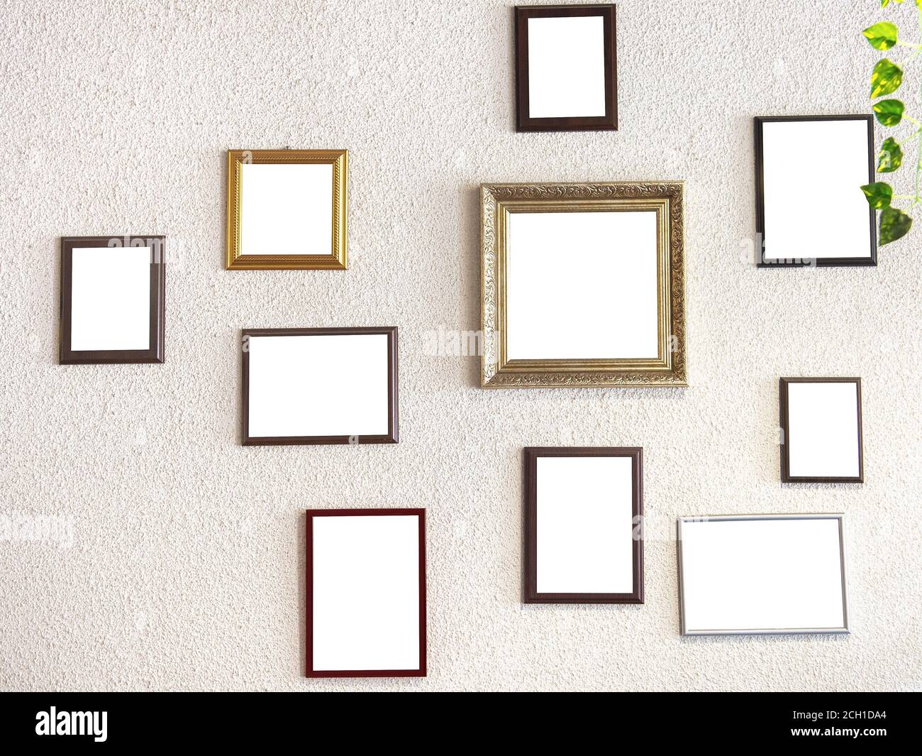mockup image. different size picture framed hanging on the gray wall. Blank of wooden frames picture hanging on concrete wall background. Various fram Stock Photo