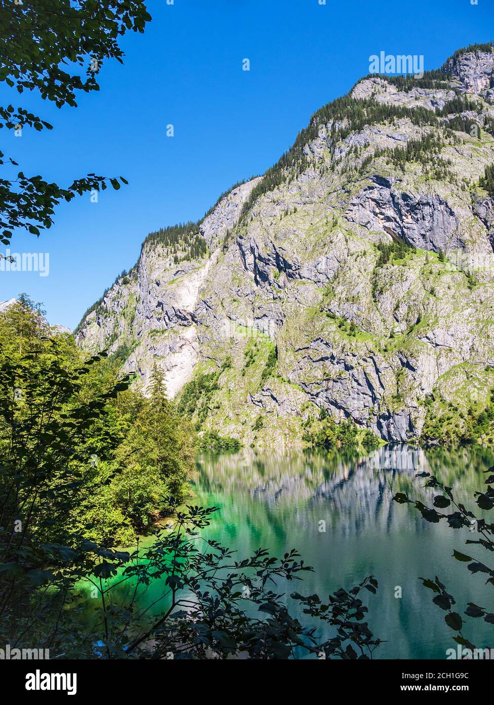 Lake Koenigssee with rocks and trees in the Berchtesgaden Alps, Germany ...