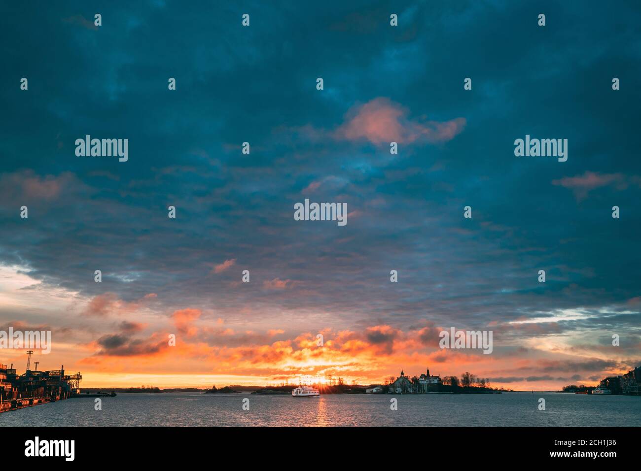 Helsinki, Finland. Touristic Boat Floating Near Valkosaari Island At Sunrise Sunset Time Stock Photo
