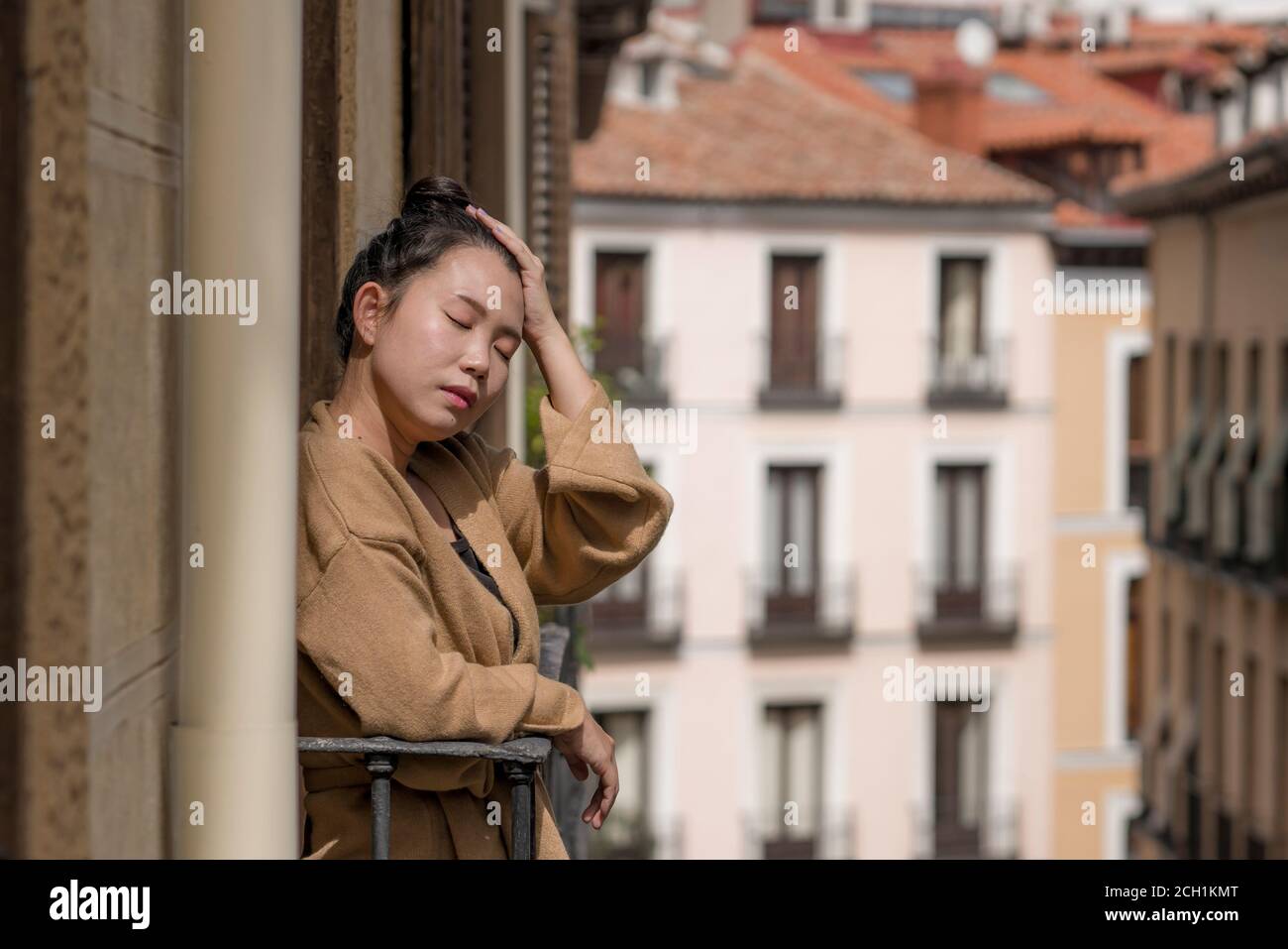 dramatic portrait of young beautiful sad and depressed Asian Japanese woman feeling unhappy and worried suffering some problem going through depressio Stock Photo