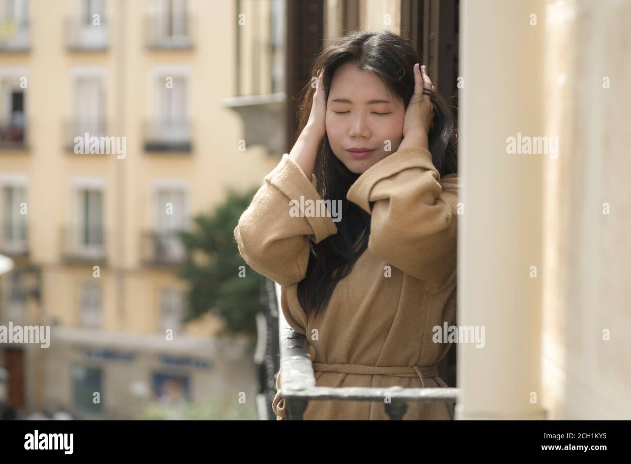 dramatic portrait of young beautiful sad and depressed Asian Japanese woman feeling unhappy and worried suffering some problem going through depressio Stock Photo