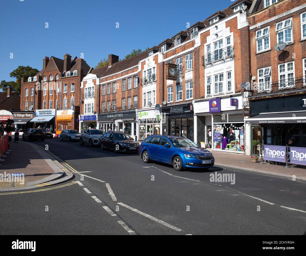 Shops in Beckenham High Street, Beckenham, Kent on a glorious sunny