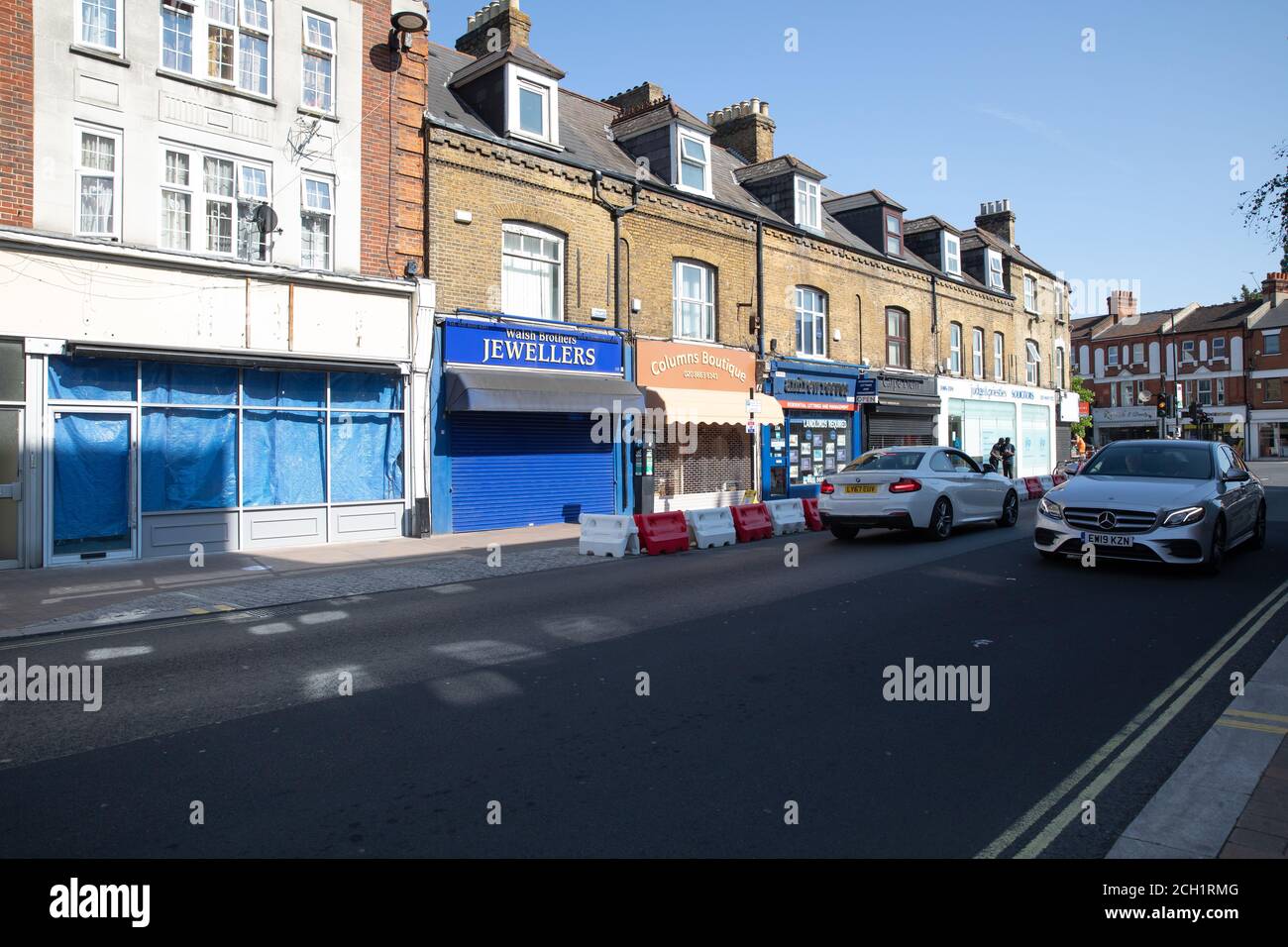 Shops in Beckenham High Street, Beckenham, Kent on a glorious sunny
