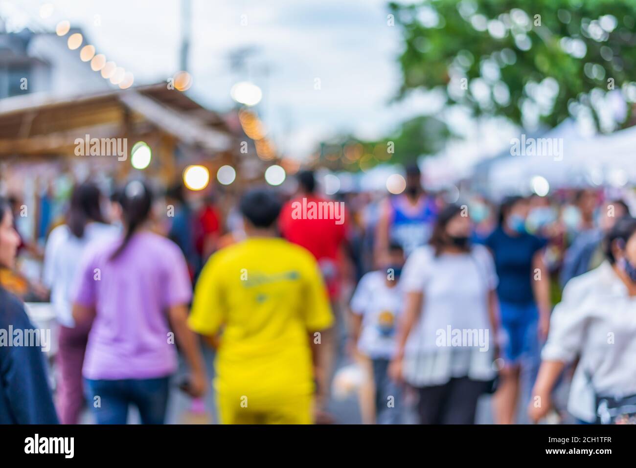 Person in focus in blurred crowd hi-res stock photography and images ...