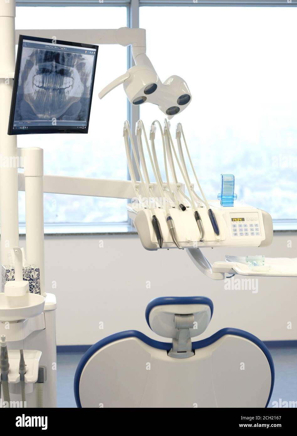 Modern dental practice. Dental chair and other accessories used by dentists. Stock Photo