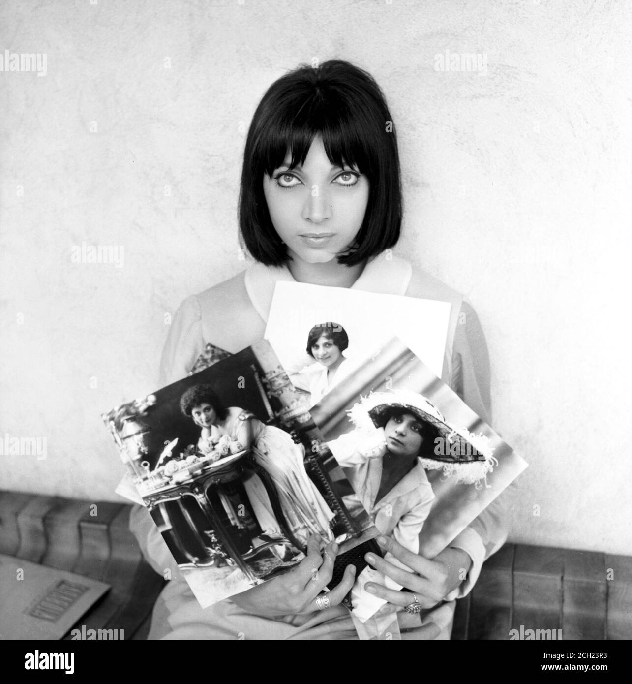 the actress Mariangela Melato with some photographs of the actress Maria Melato Stock Photo