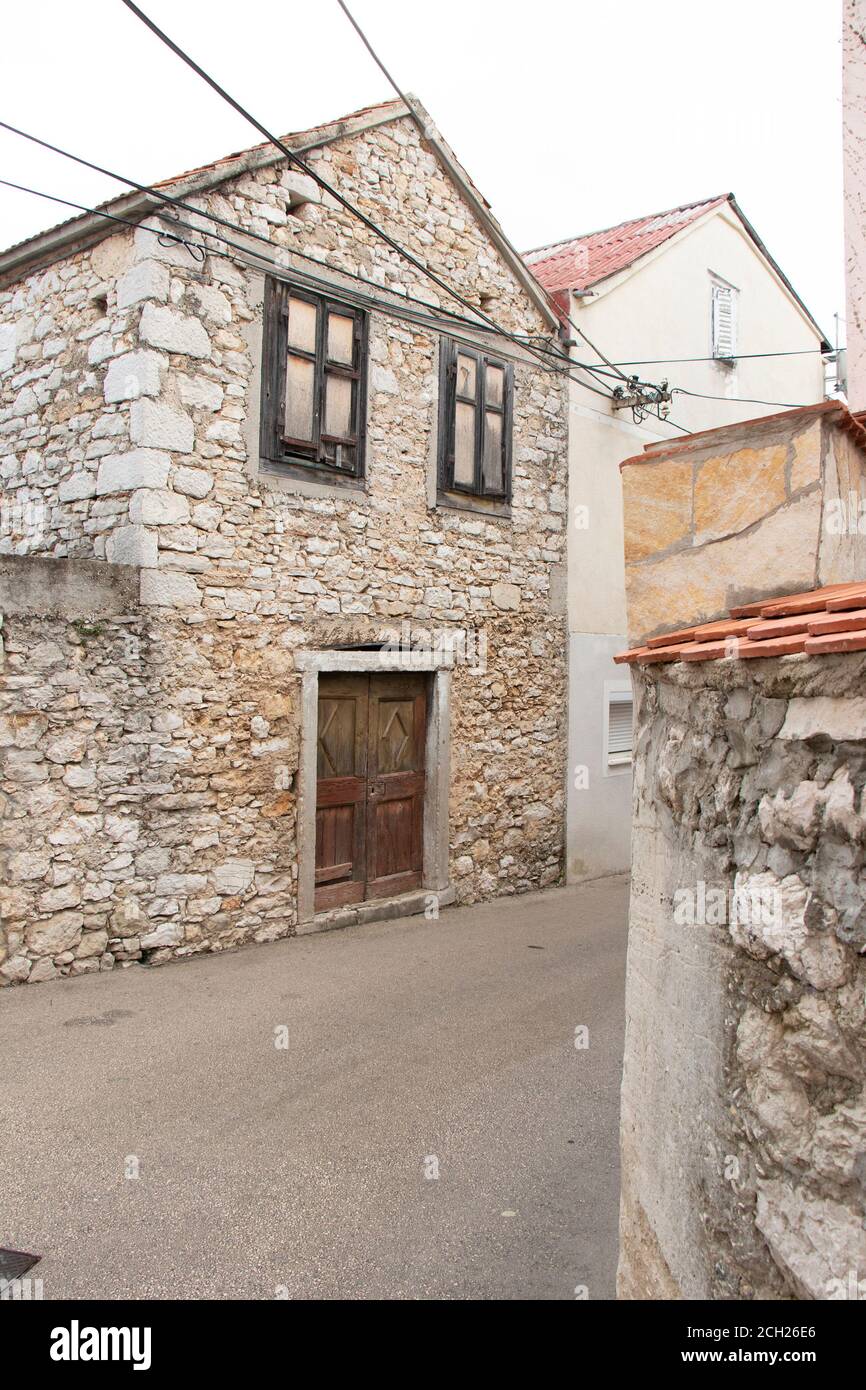 Old abandoned traditional stone house in the street of Vodice, Dalmatia Stock Photo