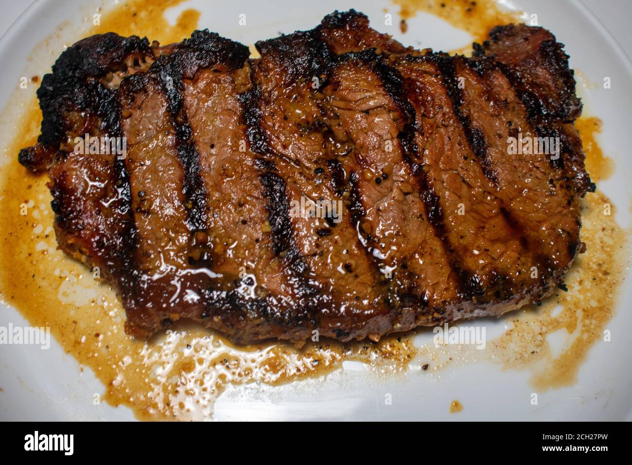 A Perfectly Cooked Steak With Grill Lines Plated on a Pure White Background Stock Photo Alamy