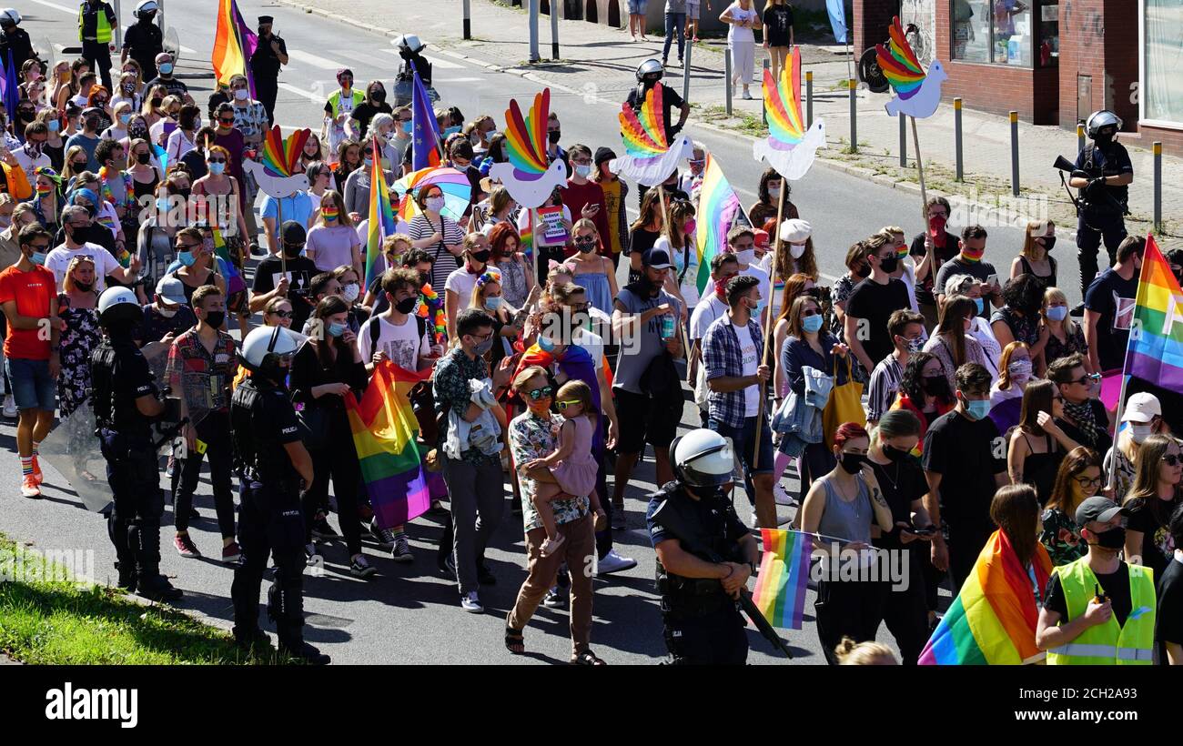 Poland - September 7, 2020: LGBT equality march. Young people wearing rainbows are fighting for LGBTQ+ rights. Police cordon surrounded people Stock Photo