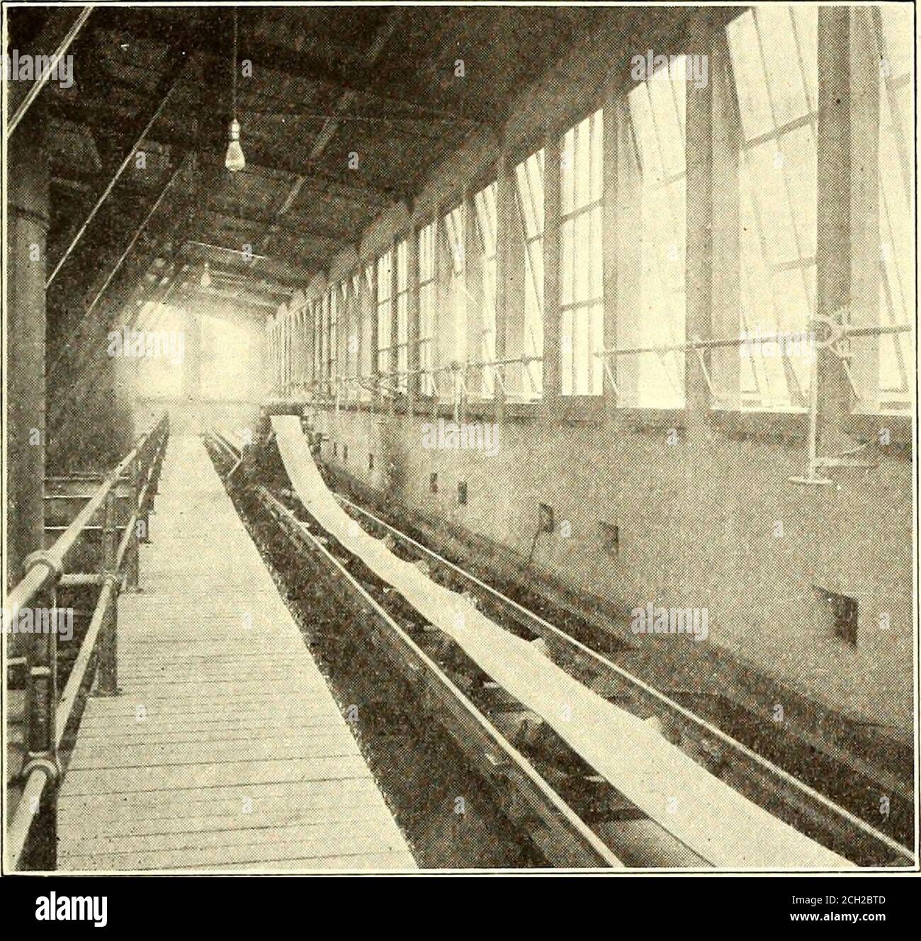 . Electric railway journal . March 5, 1910.] ELECTRIC RAILWAY JOURNAL. 391 Street, New York City, is equipped with five 1500-kw rotary-converters, with the transformers for reducing the 11,000-voltcurrent to 430 volts on the alternating side of the converters. supply to the Terminal Building, there are steam-driven gen-erators, which are used principally in the winter time whentheir exhaust steam is utilized for heating the building. When. Hudson & Manhattan Railroad Power Station—DistributingConveyor and Coal Pockets Provision is made in the substation building for the installationof storage Stock Photo
