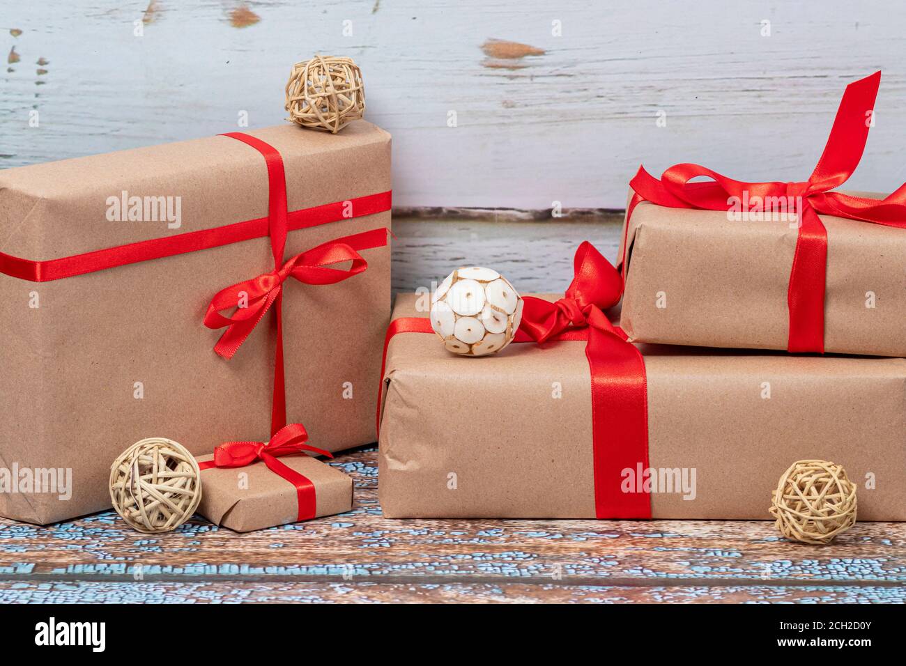 Christmas gifts and lights on wooden floor Stock Photo