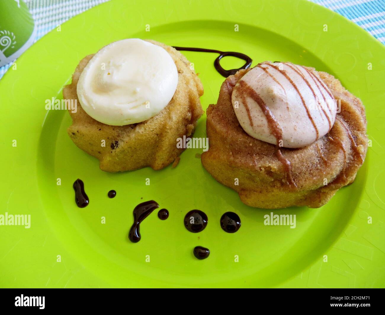 Small cakes  with frosting on a plate Stock Photo