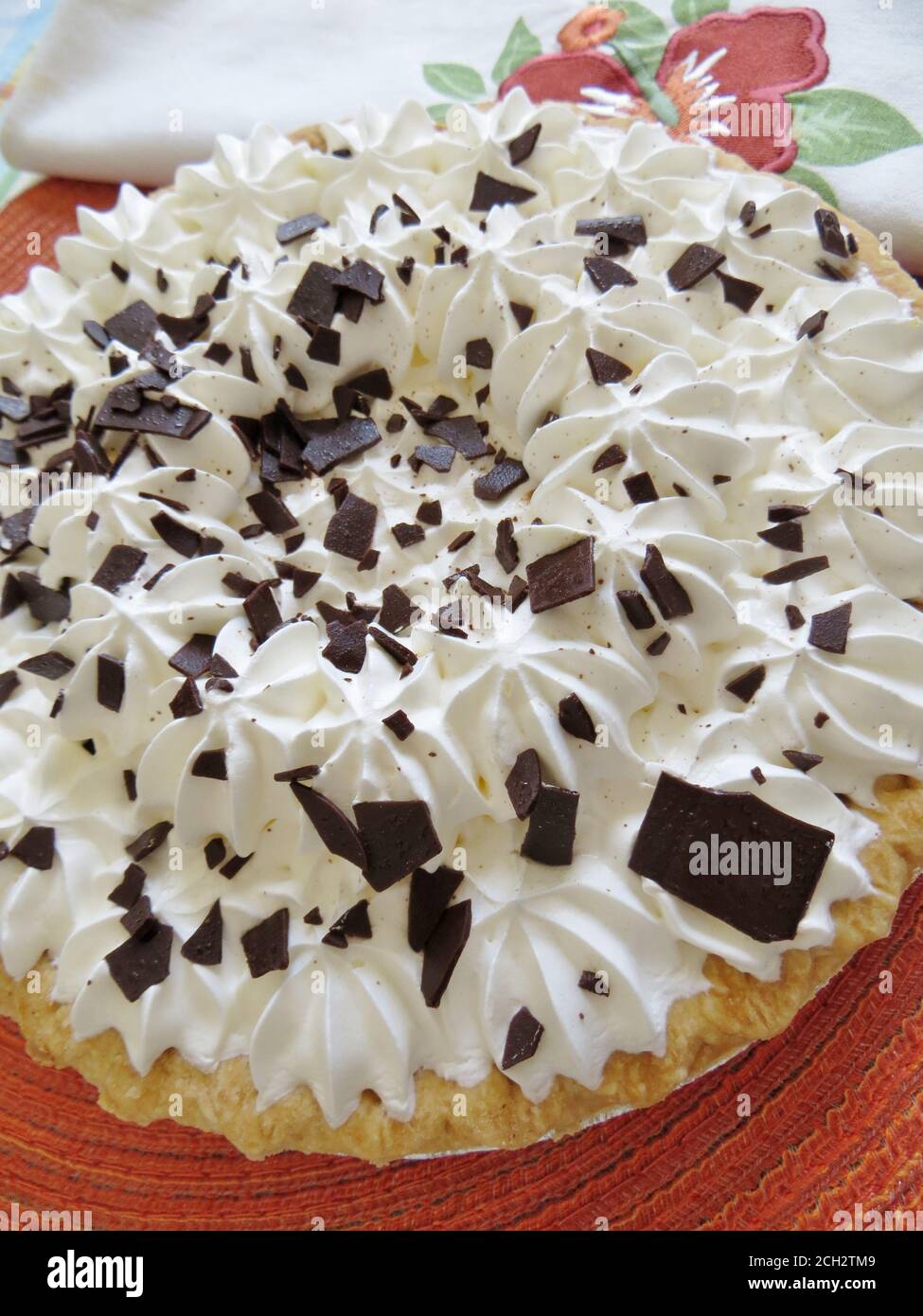 Chocolate pie with whipped cream topping and chocolate shavings Stock