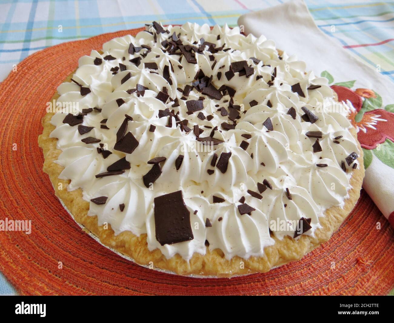 Chocolate pie  with whipped cream topping and chocolate shavings Stock Photo