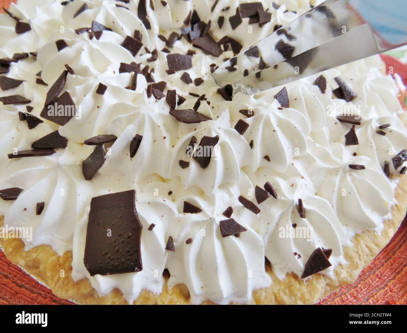 Chocolate pie with whipped cream topping and chocolate shavings Stock