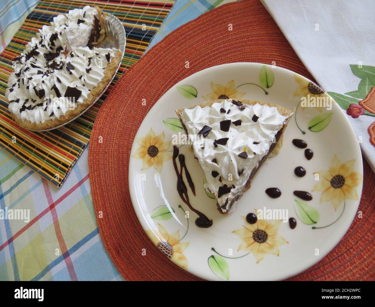 A slice of chocolate cream pie with whipped topping Stock Photo