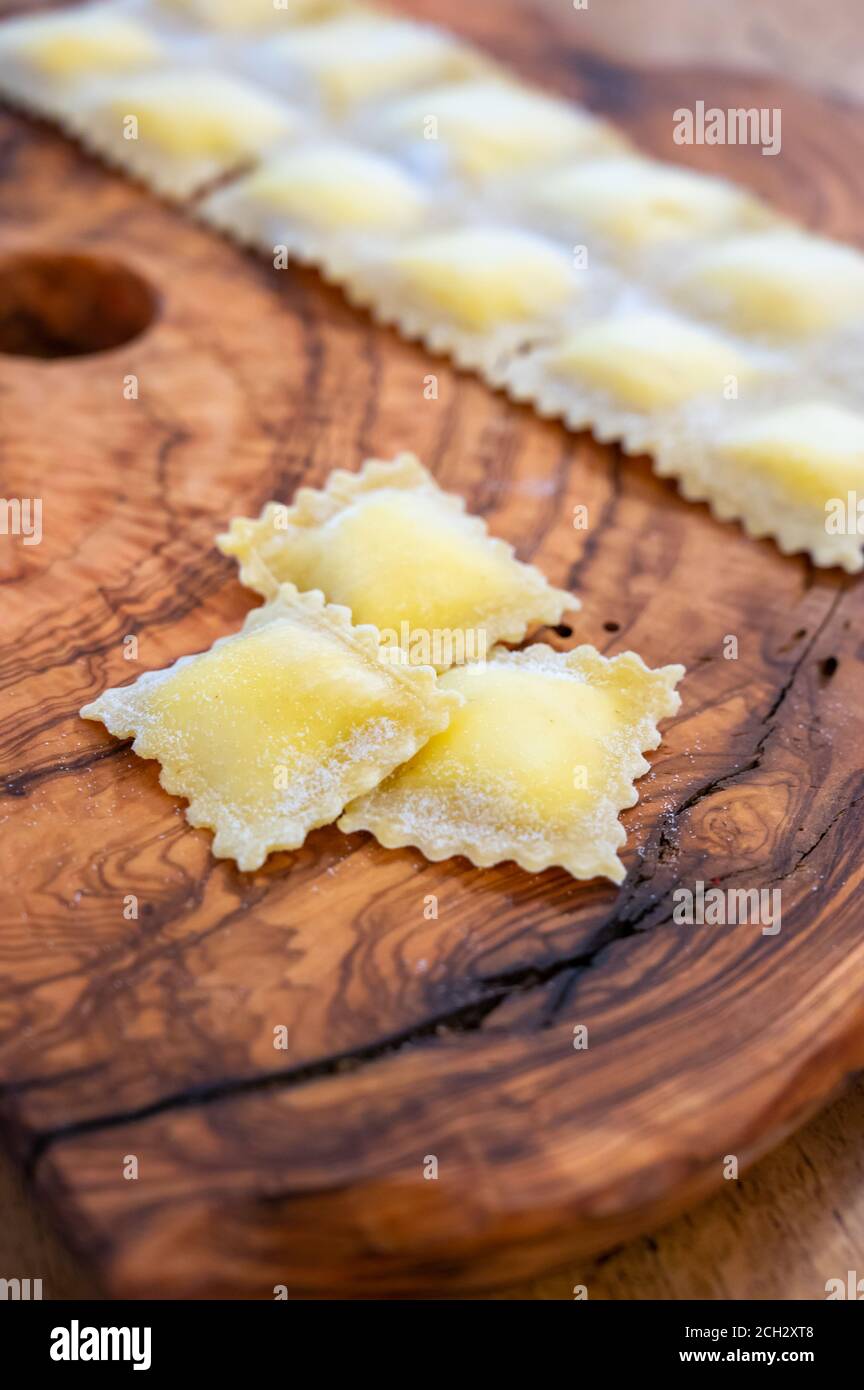 Handmade uncooked fresh ravioli with four cheeses filling, tasty ...