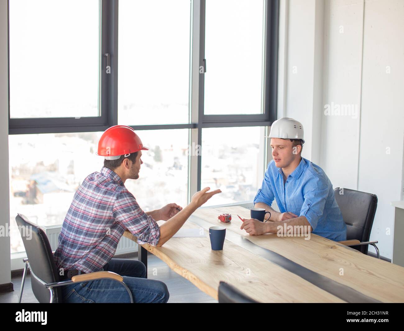 two friends are having conversation in coffee break Stock Photo