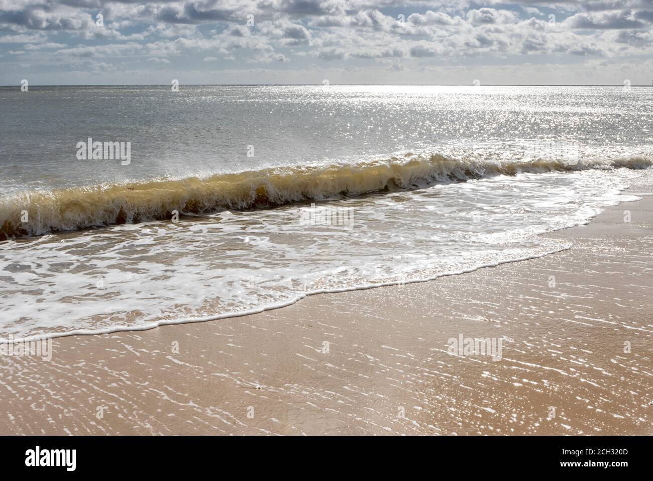 Early morning quiet with sun sea and sand, North Norfolk, East Anglia, UK Stock Photo