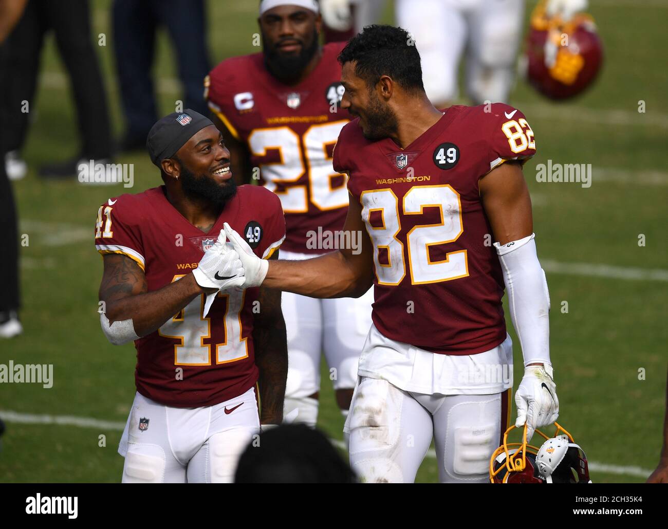 Landover, United State. 13th Sep, 2020. Washington Football Team running back J.D. McKissic (41) celebrates with teammate tight end Logan Thomas (82) after the Football Team defeated the Philadelphia Eagles 27-17, at FedEx Field in Landover, Maryland on September 13, 2020. Photo by Kevin Dietsch/UPI Credit: UPI/Alamy Live News Stock Photo