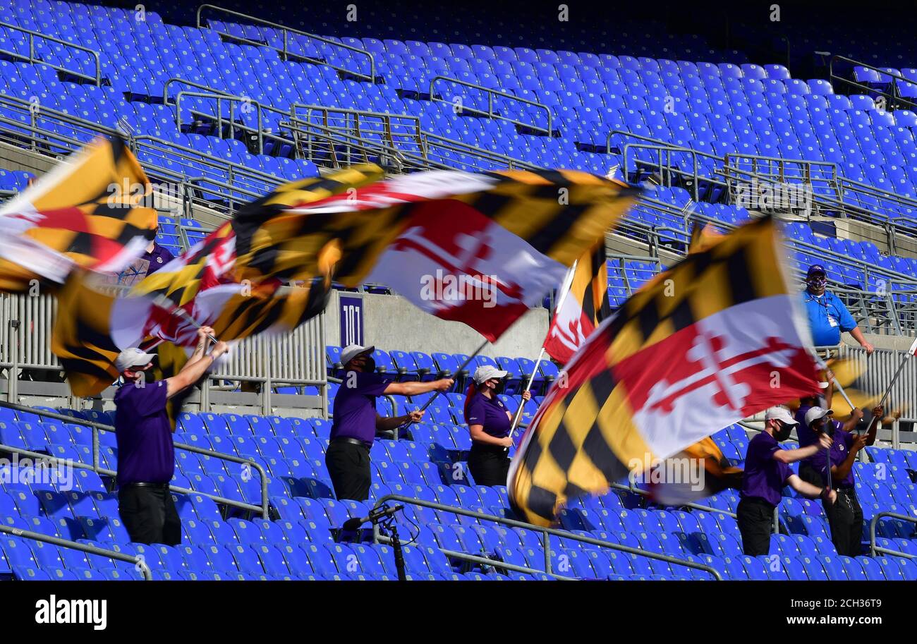 Baltimore, United States. 13th Sep, 2020. Baltimore Ravens spirit team members twirl flags in a stadium without fans because of health safety concerns from the coronavirus pandemic during the second half of an NFL season opener football game at M&T Bank Stadium in Baltimore, Maryland, on Sunday, September 13, 2020. Baltimore defeated Cleveland 38-6. Photo by David Tulis/UPI Credit: UPI/Alamy Live News Stock Photo
