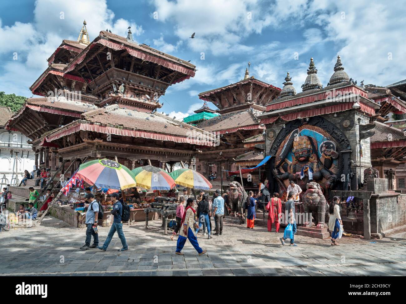 KATHMANDU, NEPAL - AUGUST 14, 2018: Unidentified nepalese woman sit in the street of Kathmandu Stock Photo