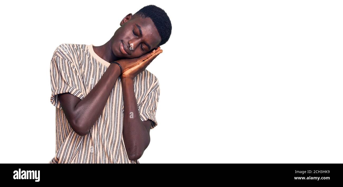 Young african american man wearing casual clothes sleeping tired ...