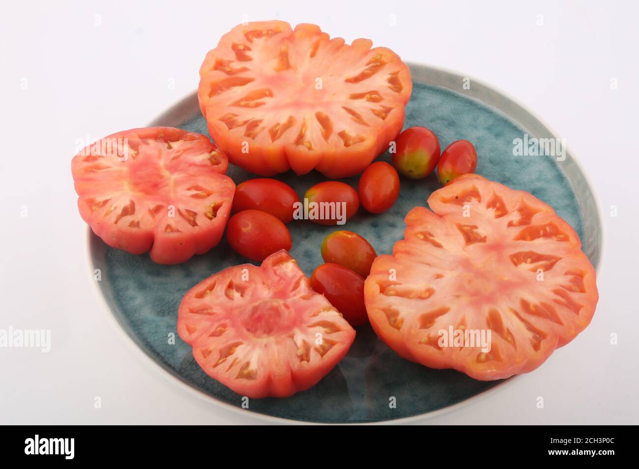 sliced and cherry tomatoes Stock Photo