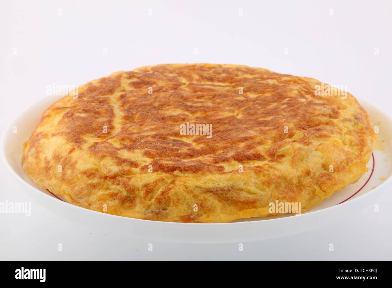 typical spanish omelette with eggs onions and potatoes Stock Photo Alamy