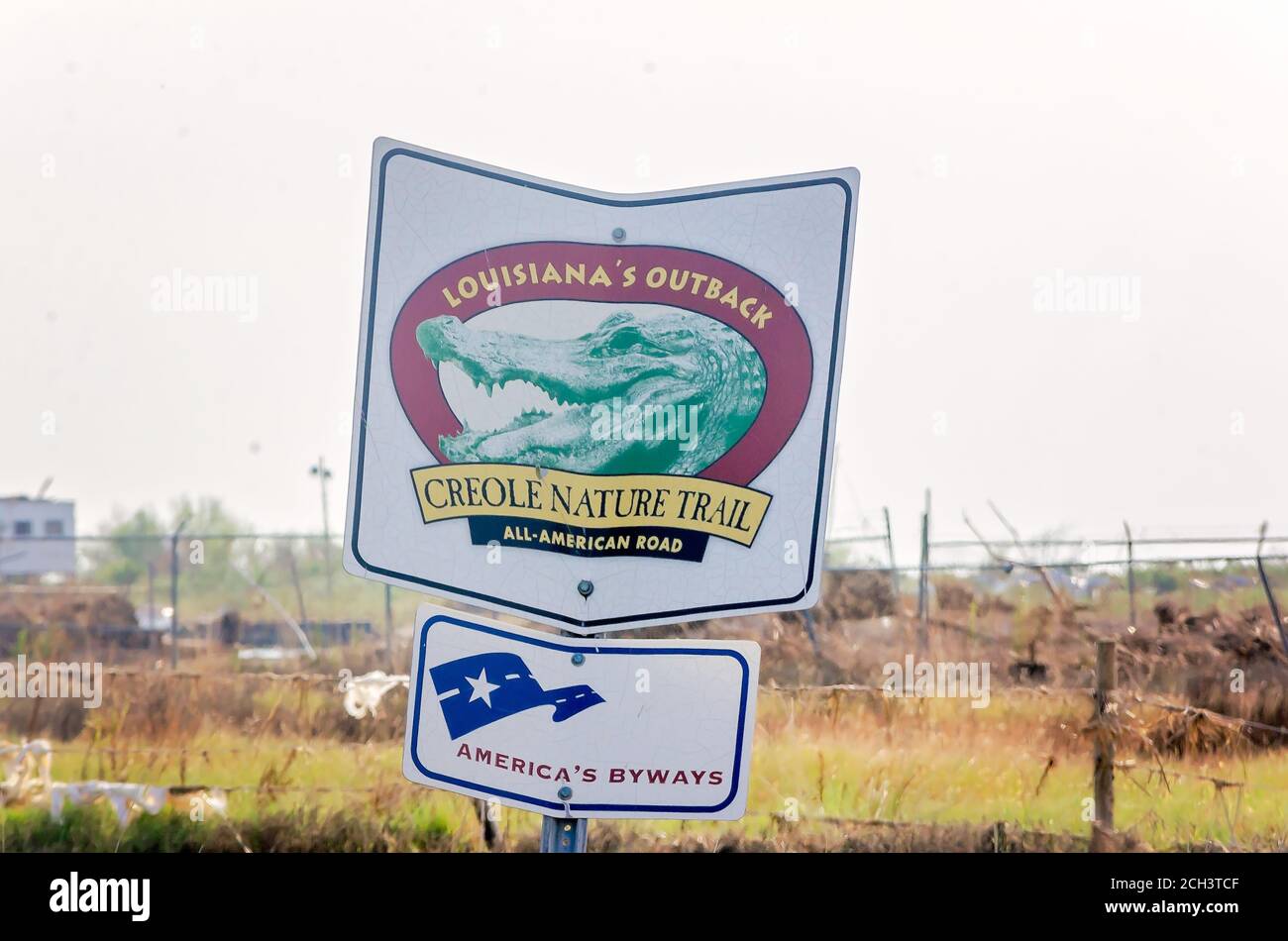 A sign damaged by Hurricane Laura advertises the Creole Nature Trail, Sept. 11, 2020, in Cameron, Louisiana. The town sustained heavy damage when the Stock Photo