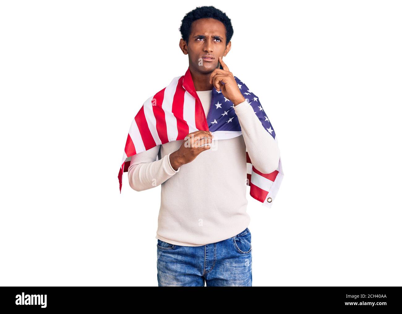 African handsome man holding united states flag serious face thinking ...